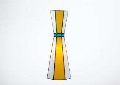 Modern pendant lamp with geometric design and warm light.