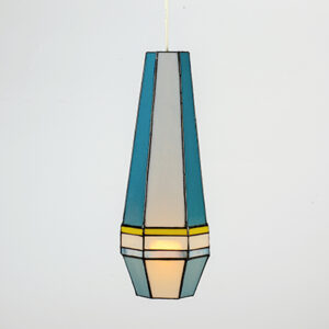 A modern geometric pendant lamp with blue, yellow, and white panels.