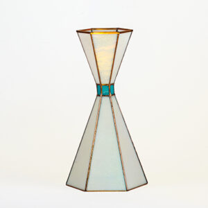A modern geometric glass vase with stained glass design.